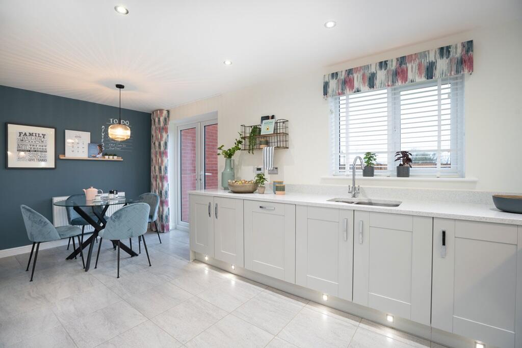 Sociable kitchen with breakfast area and doors to garden