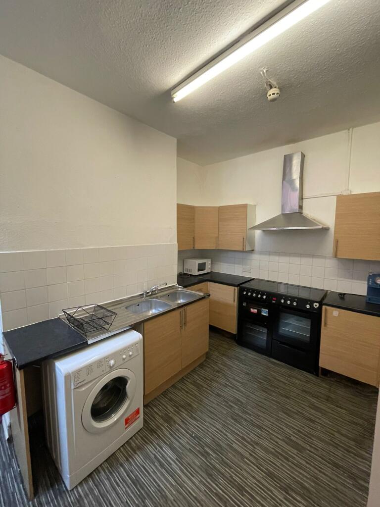 A spacious and functional kitchenette featuring...