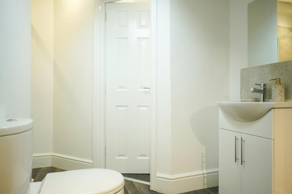 A bright and clean bathroom featuring modern fi...