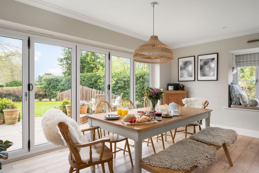 Dining area with Bi Fold Doors to Garden
