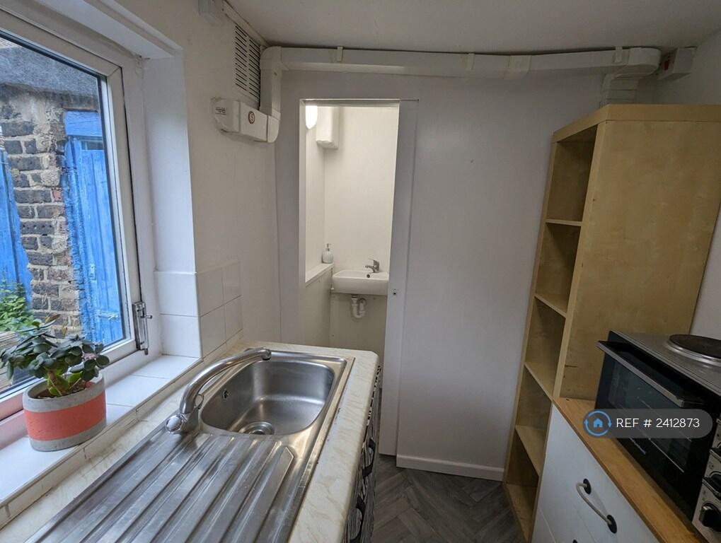 Kitchen With Shower Room Beyond