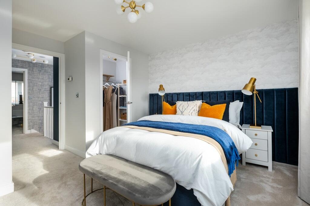 The main bedroom is complete with a walk-in wardrobe and ensuite