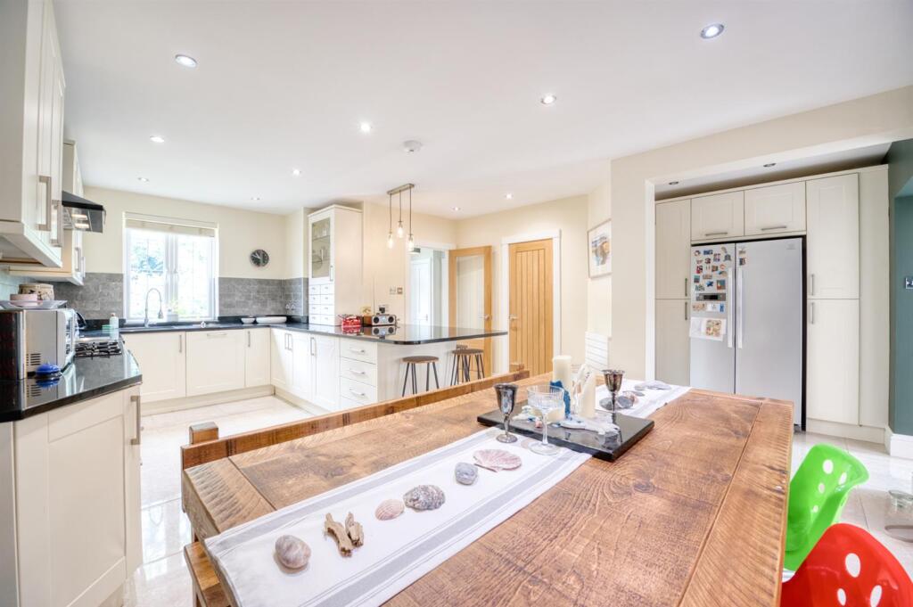 Dining table towards kitchen.jpg