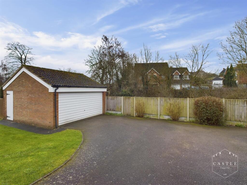 OUTSIDE - DOUBLE GARAGE