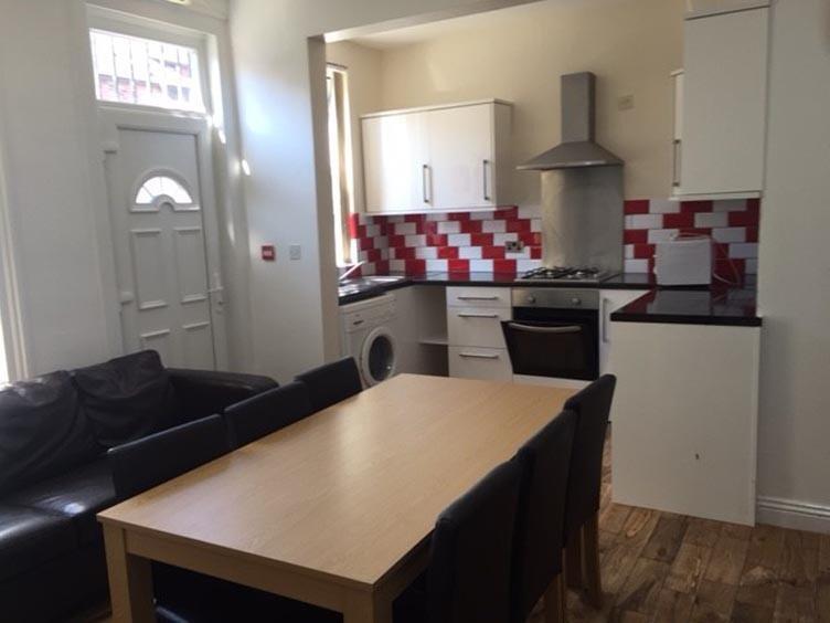 A bright and neatly maintained kitchen with mod...