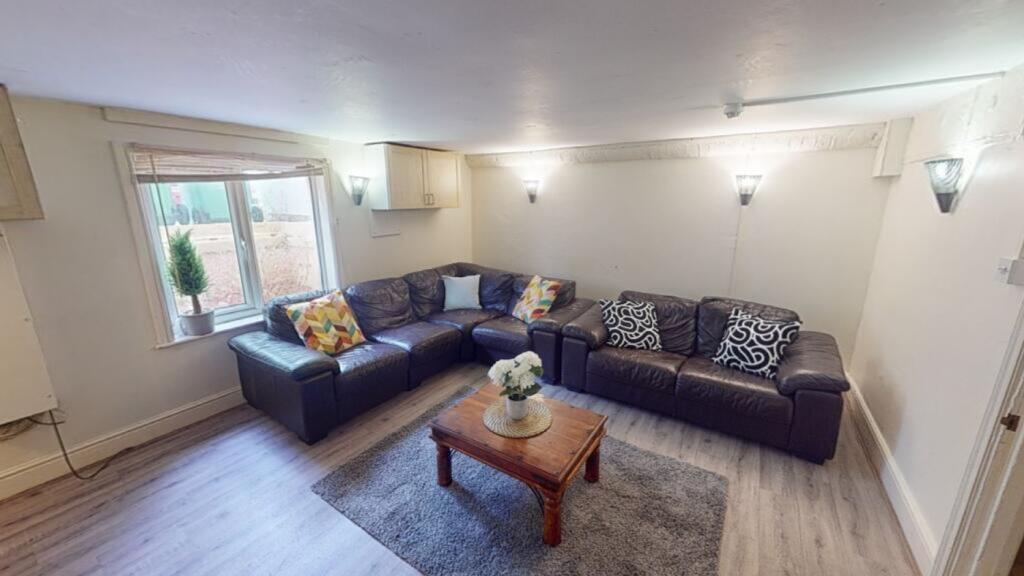A spacious and inviting large modern living roo...