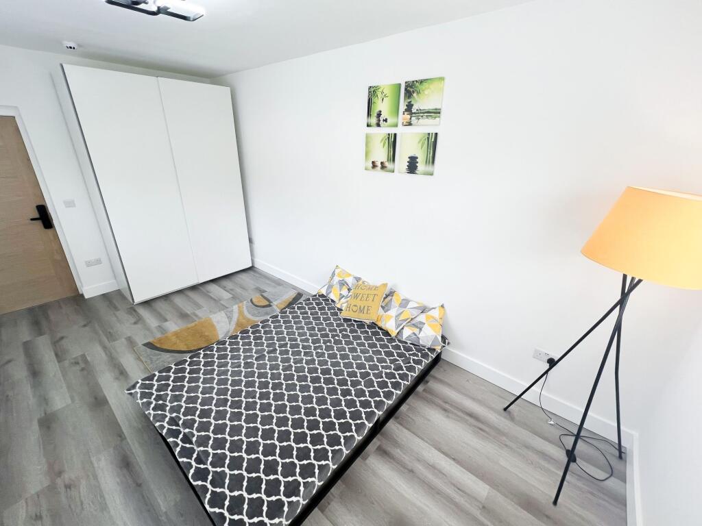 A modern double bedroom featuring a comfortable...