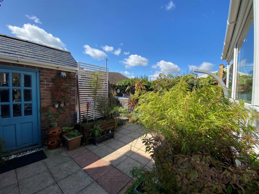 garden with brick store