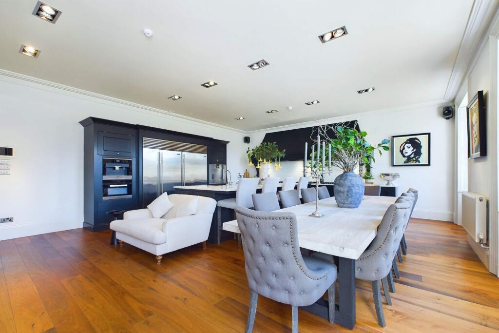 Contemporary kitchen with island and dining