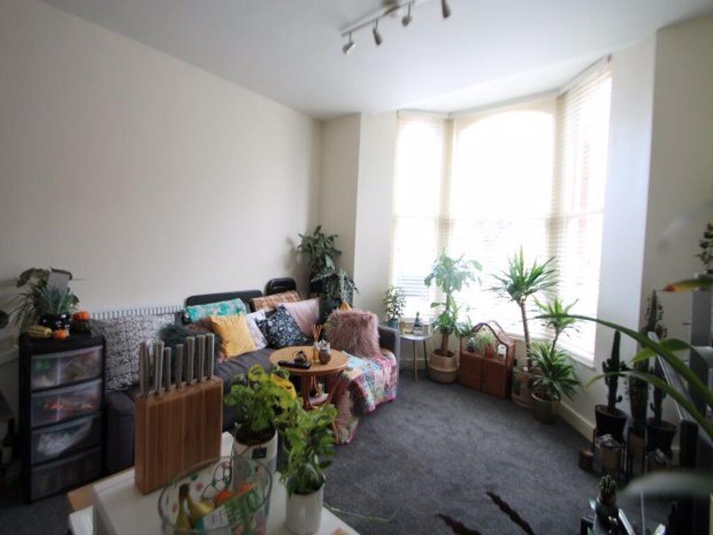 A bright and welcoming living room filled with ...