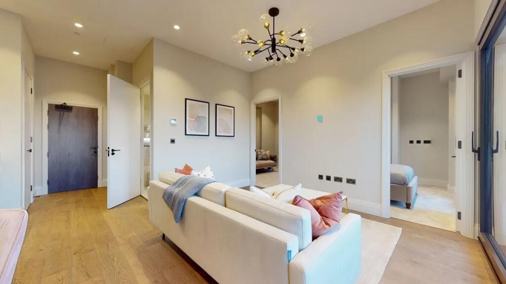 A modern and stylish living room featuring a co...