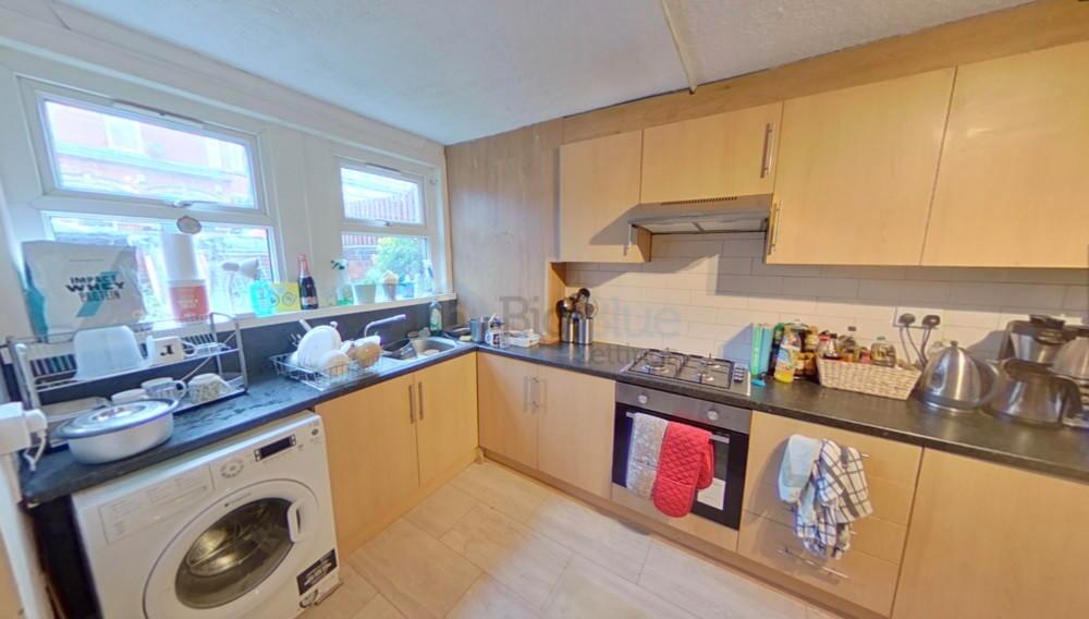 Bright and functional kitchen space featuring a...