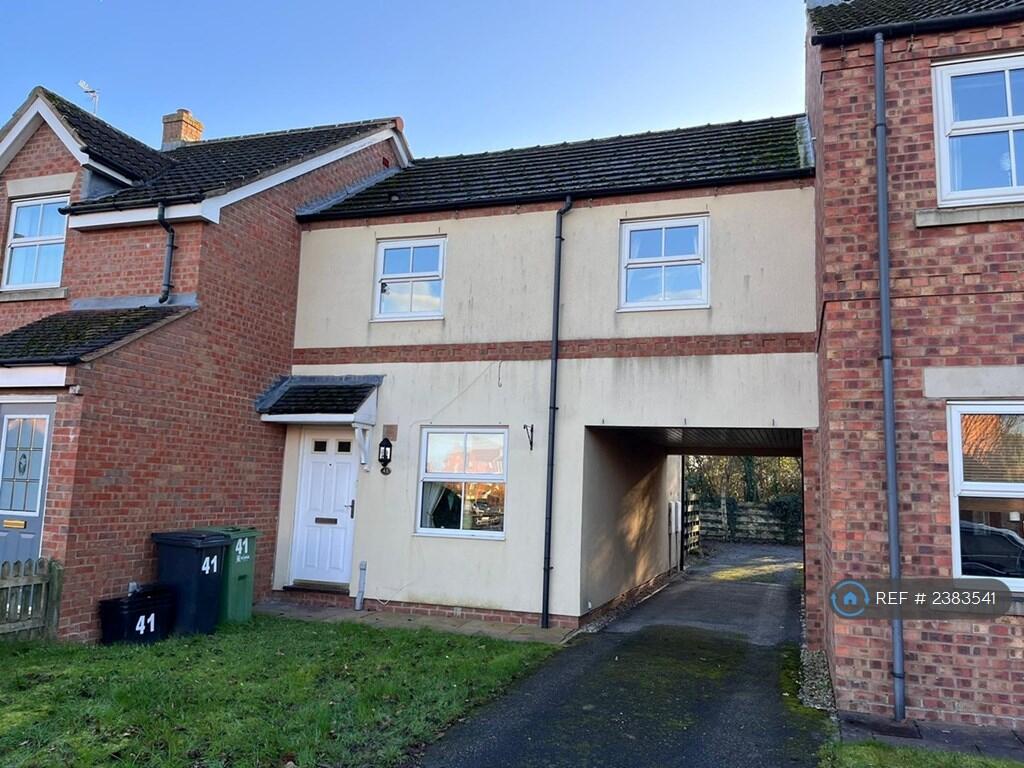 Front Door And Archway To Parking