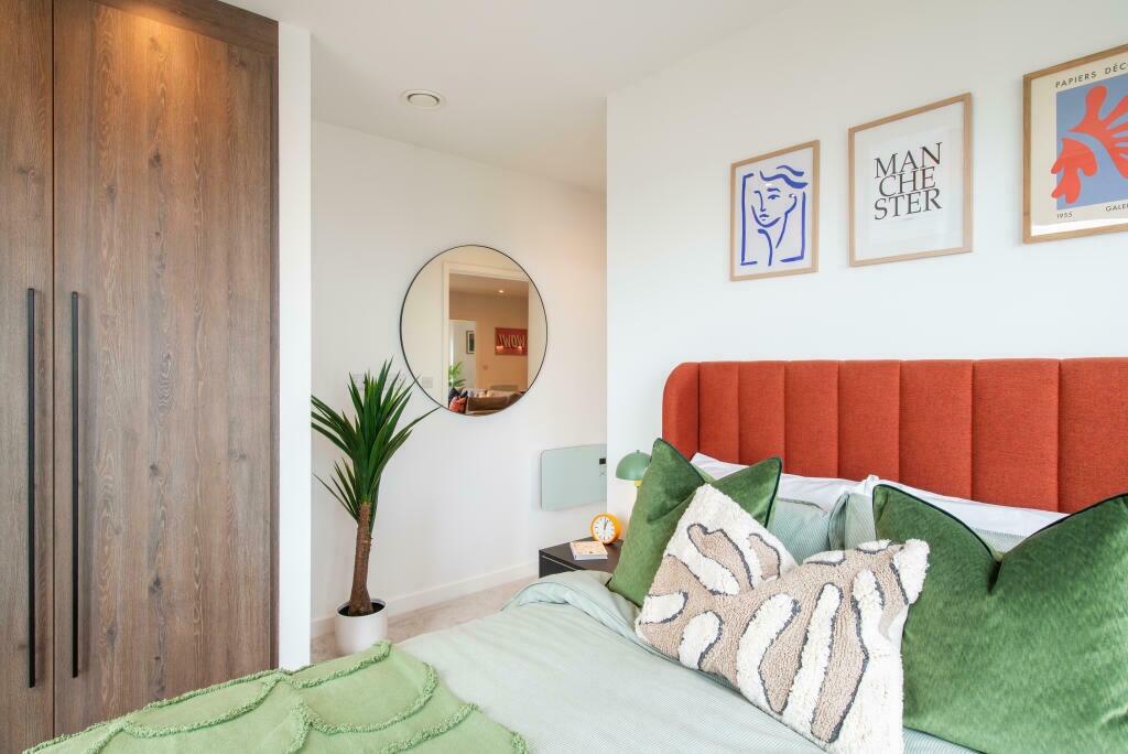 A stylish double bedroom featuring a vibrant or...