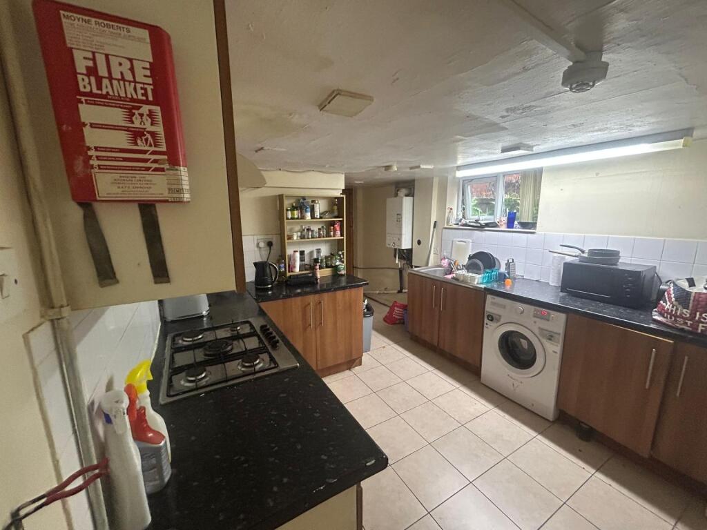 A well-maintained kitchen area featuring essent...