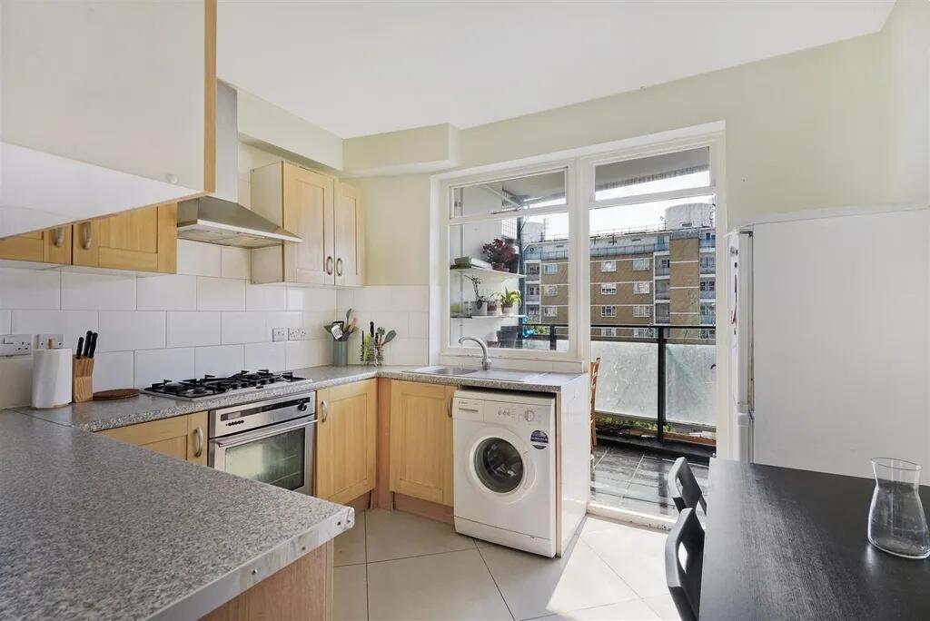 Bright and well-maintained kitchen featuring mo...