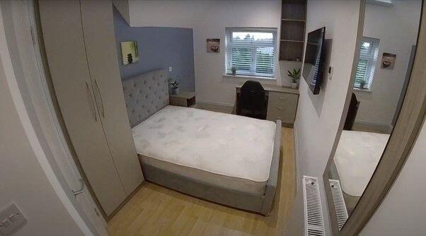 Neat double bedroom with built-in wardrobes, a ...