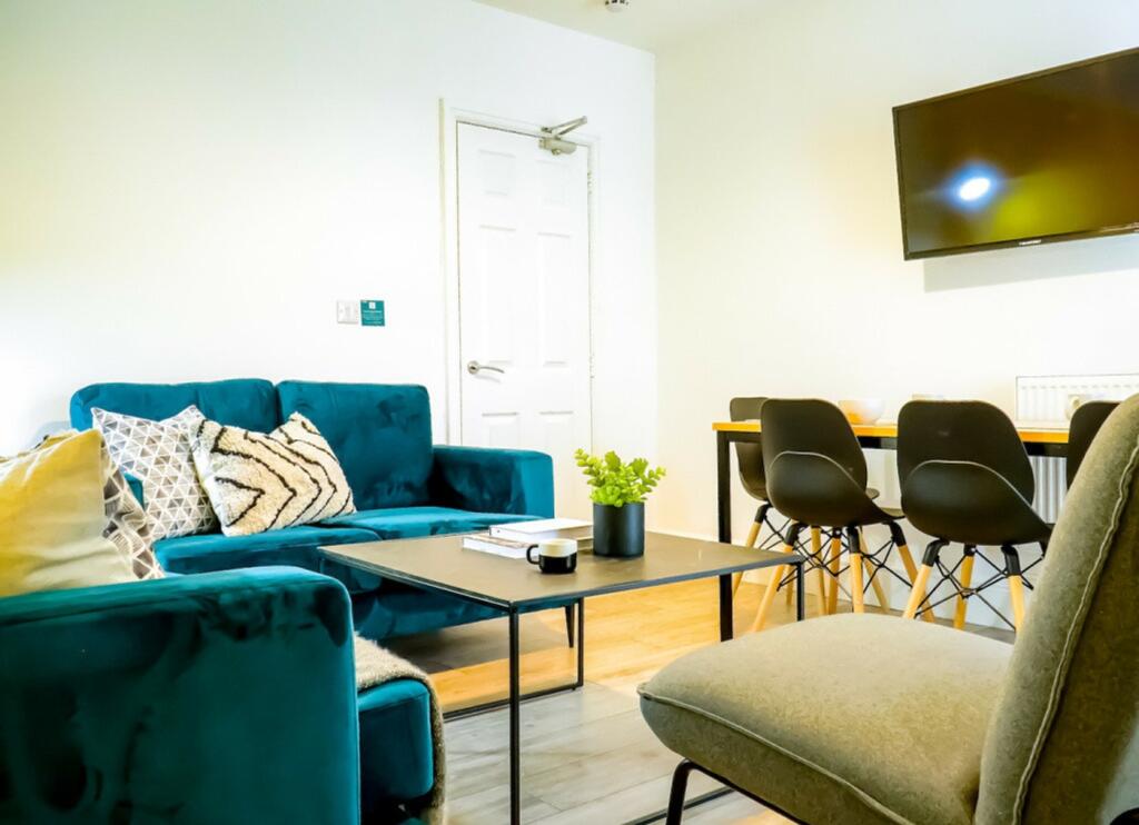 A stylish and spacious modern living room perfe...
