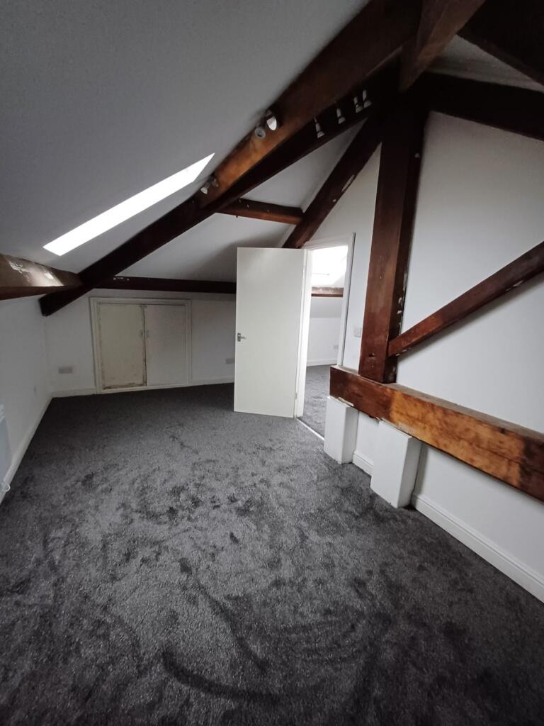 A charming double bedroom featuring spacious fl...