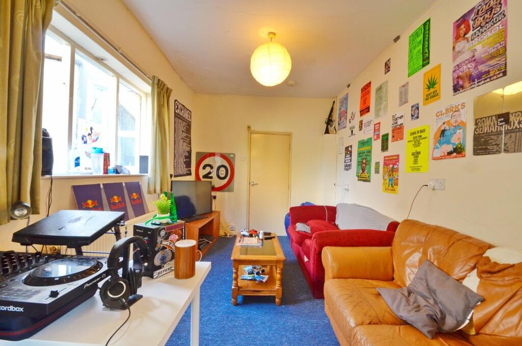 A cozy and vibrant living room featuring comfor...