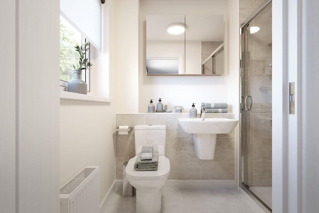 The main bedroom boasts its own en-suite shower room