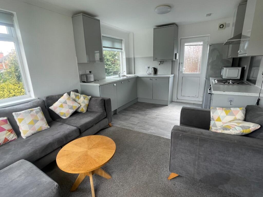 Bright and inviting living room with modern fur...
