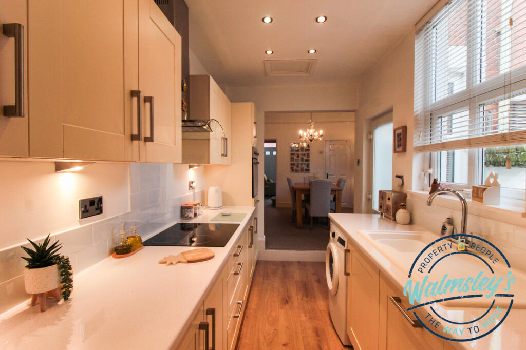 Kitchen with dining room beyond