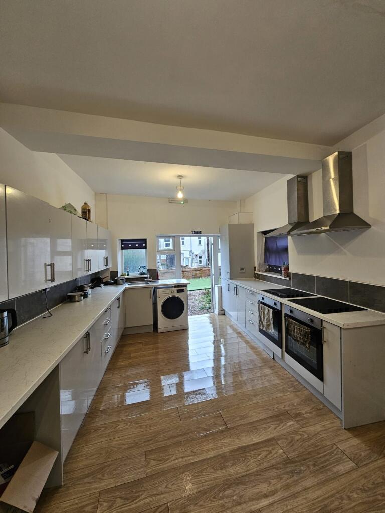 Bright and modern kitchen with ample counter sp...