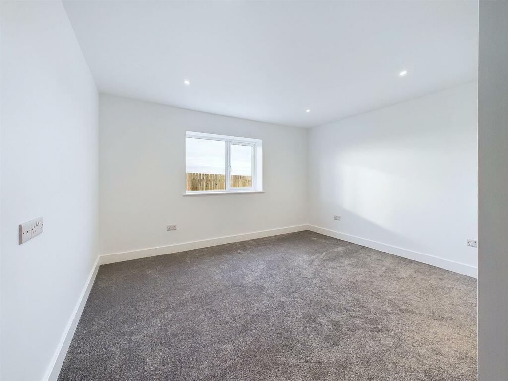 Sample Bedroom carpeted.