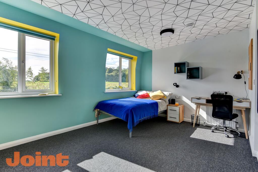 Bright and cheerful single bedroom with vibrant...