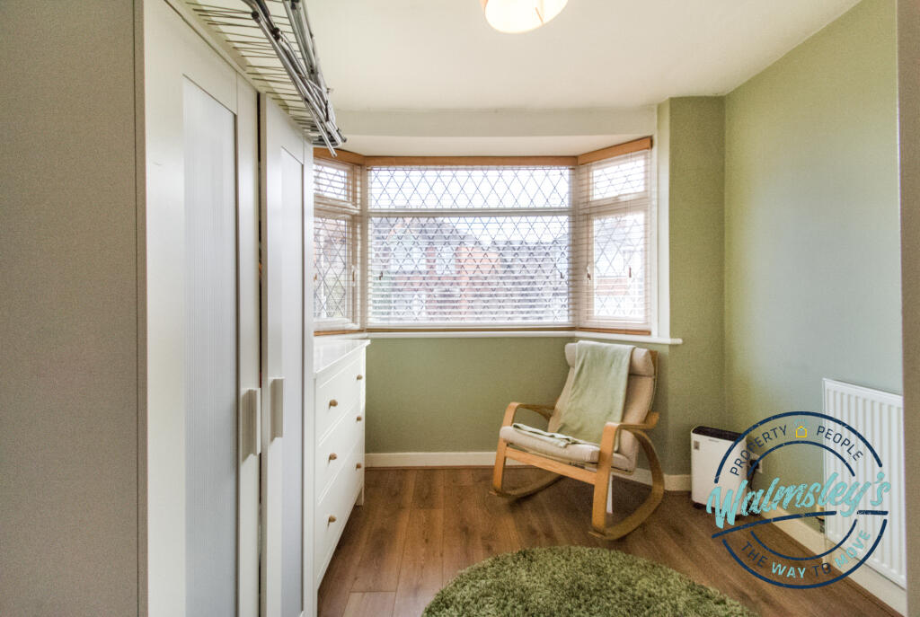 Front double bedroom currently used as a dressing 