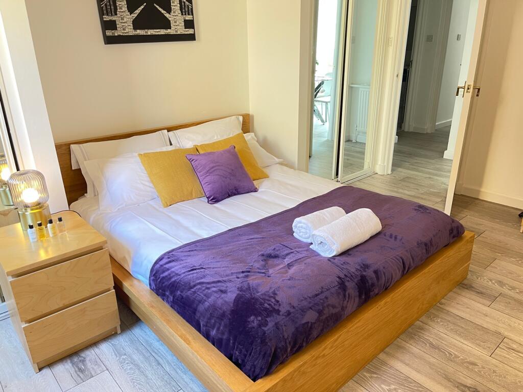 A beautifully decorated double bedroom featurin...