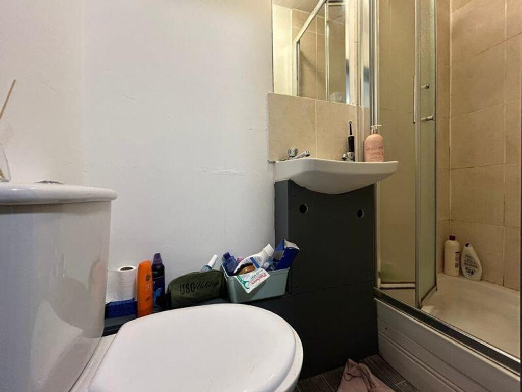 A functional bathroom featuring a shower and es...