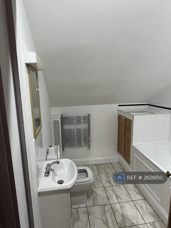 Bathroom With Washing Machine In Cupboard