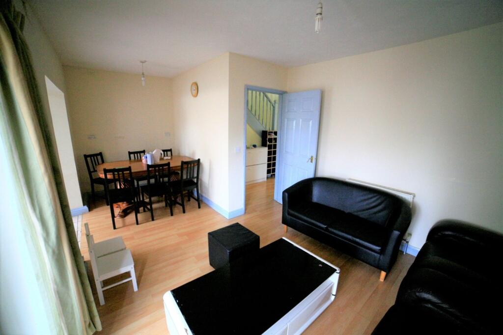 Bright and inviting living room featuring comfo...