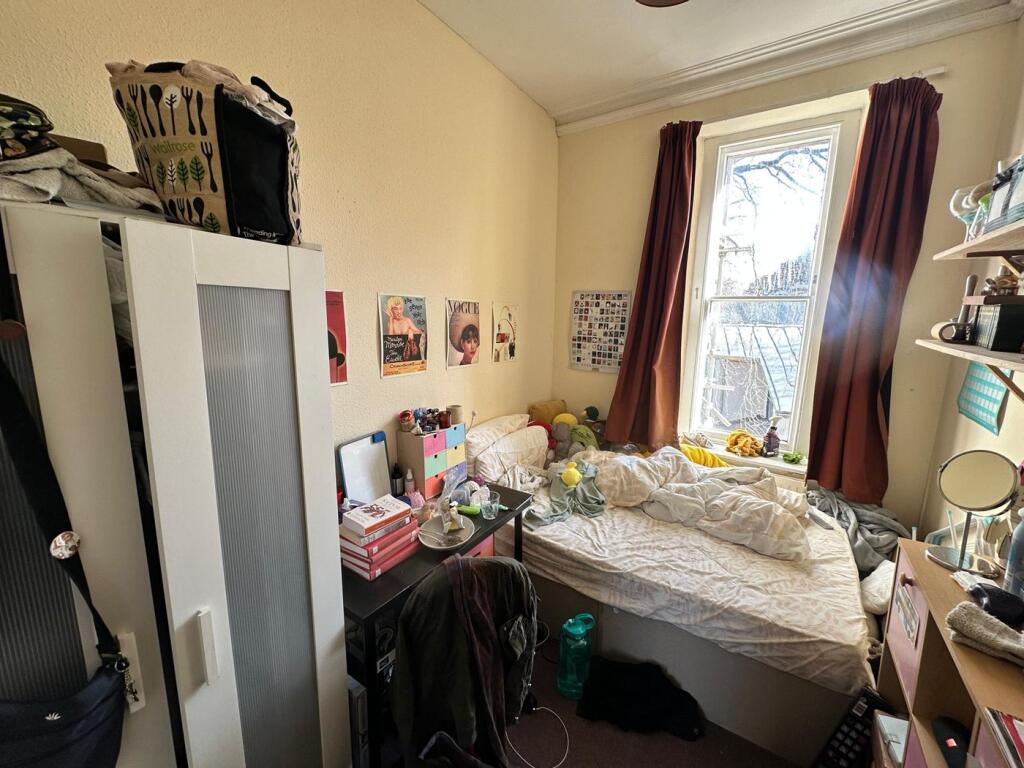 A cozy double bedroom filled with natural light...
