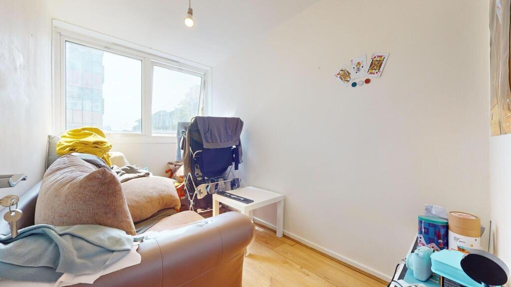 A cozy communal lounge featuring a comfortable ...