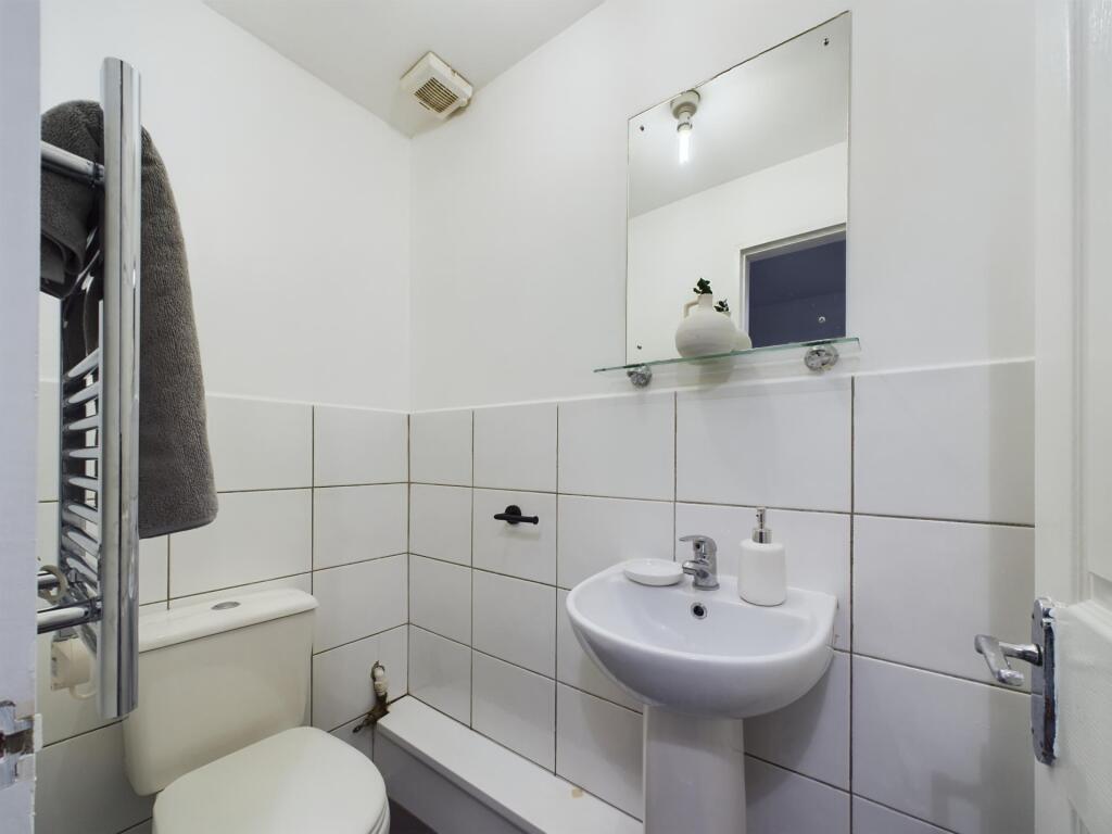 A clean and well-maintained bathroom with a toi...