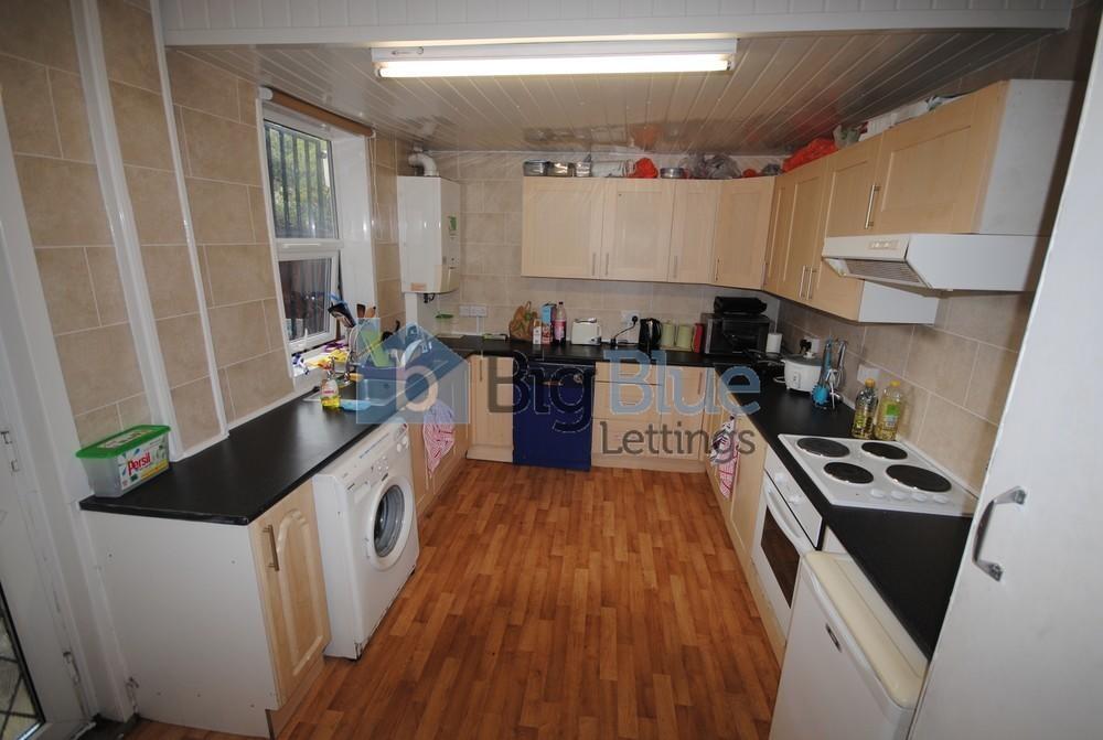 A bright and functional kitchen featuring ample...