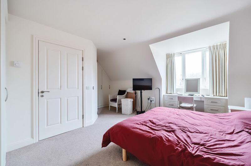 Bedroom with fitted wardrobes and ens...