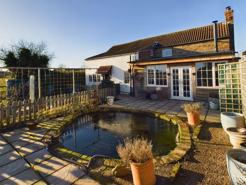 Rear elevation. ornamental pond