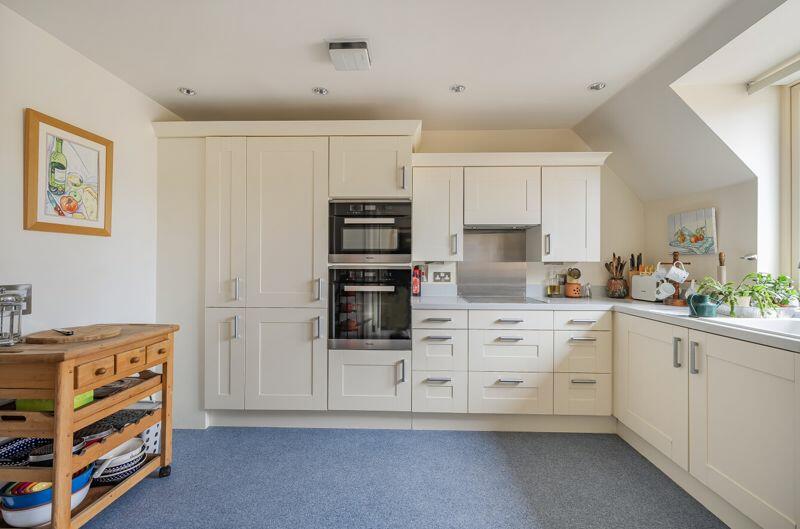 Kitchen with built-in appliances