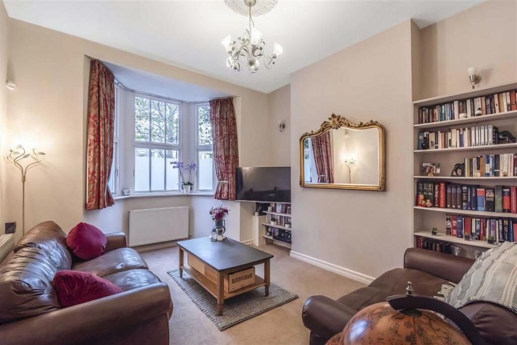 A spacious and well-maintained living room feat...
