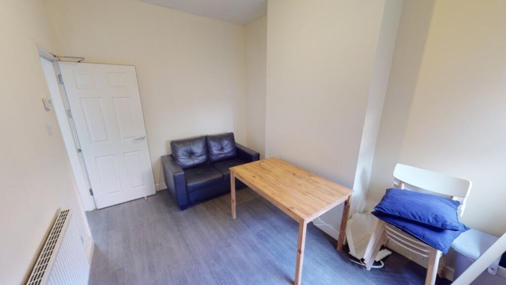 A tidy and inviting living room perfect for rel...
