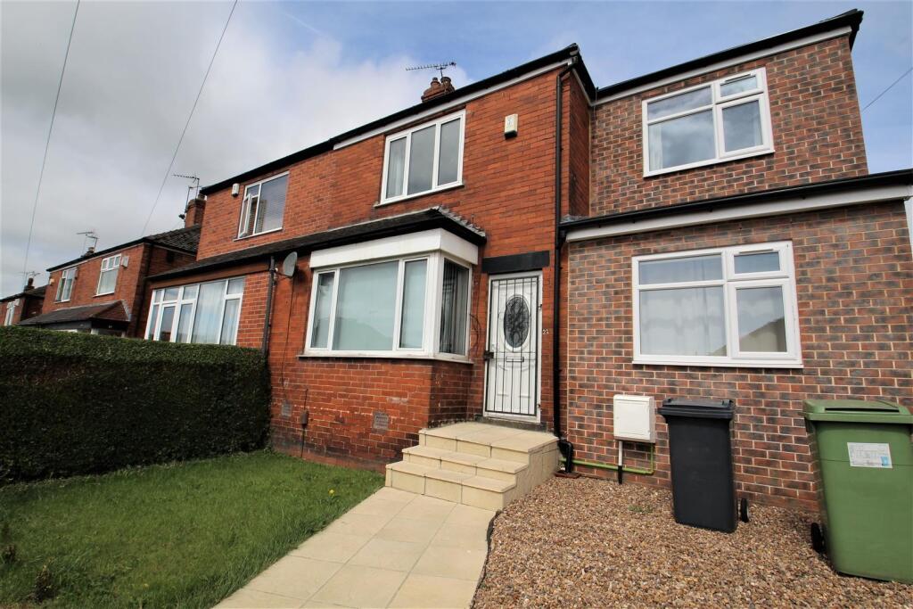 A well-maintained red brick terraced house feat...