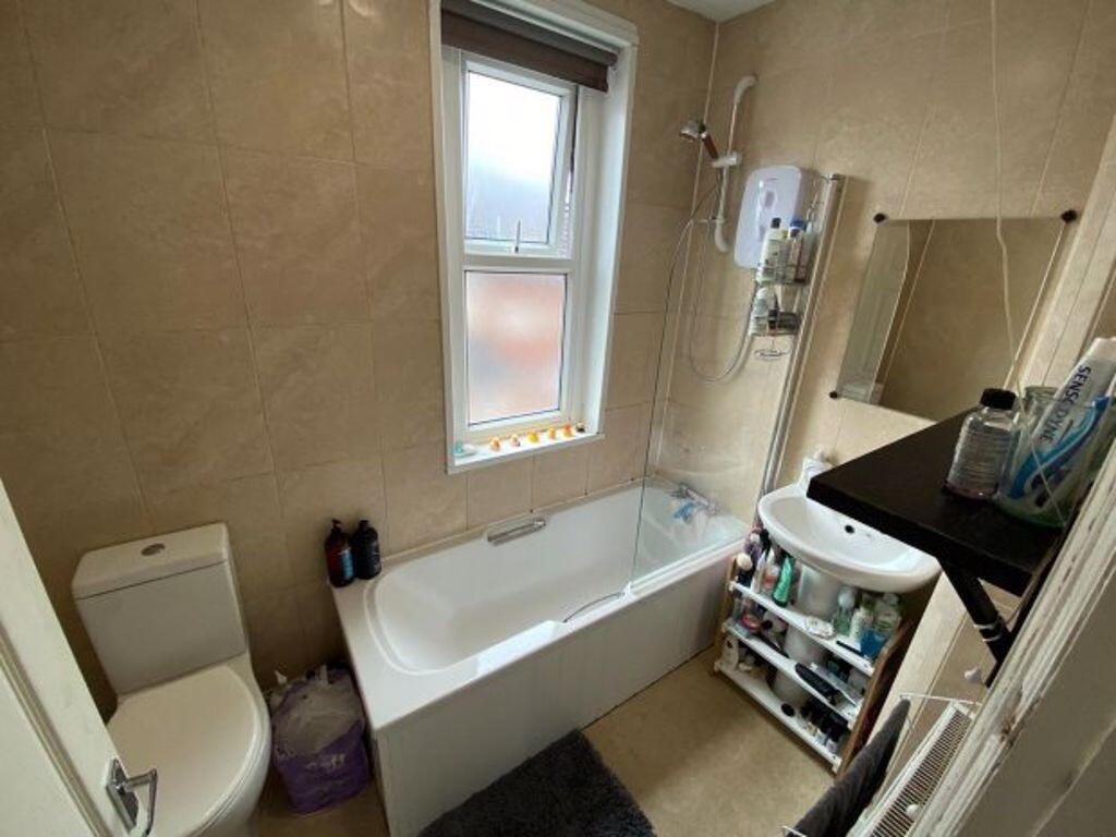 A bright and well-maintained bathroom featuring...