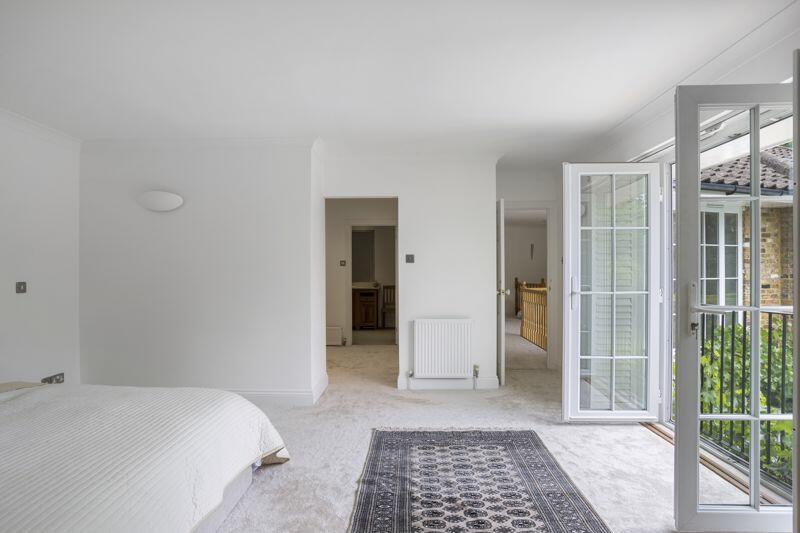 Principal bedroom with balcony