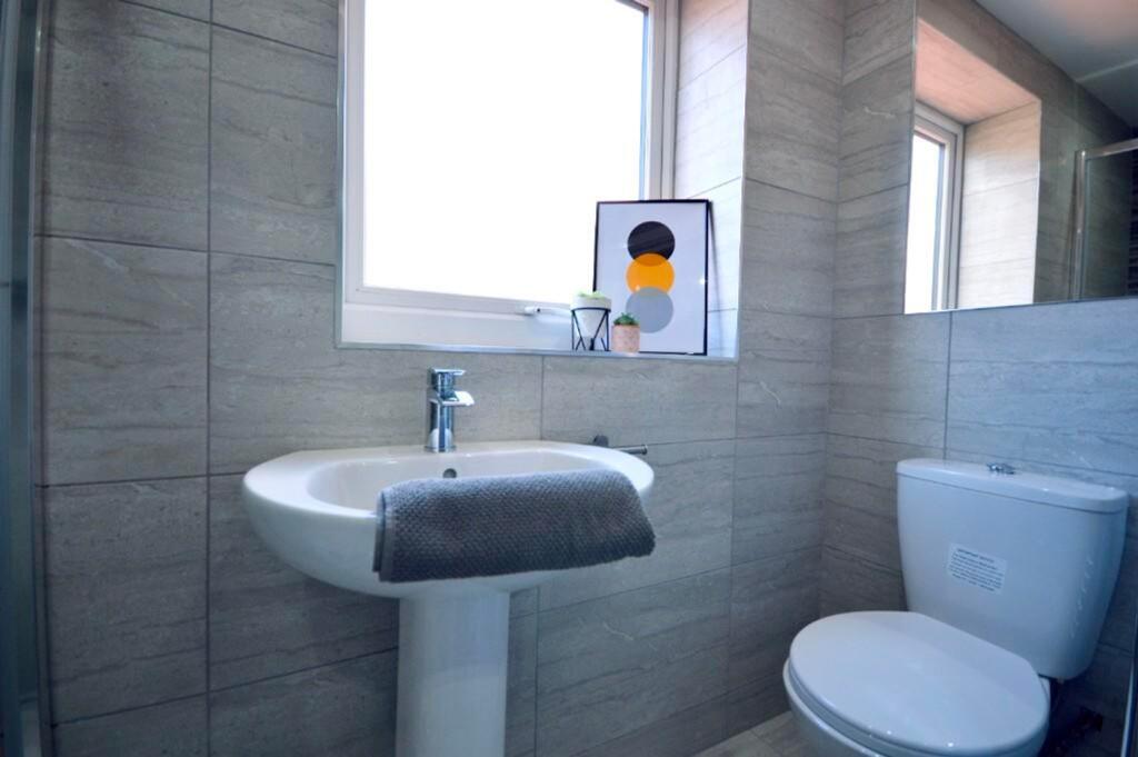 A modern and well-maintained bathroom featuring...