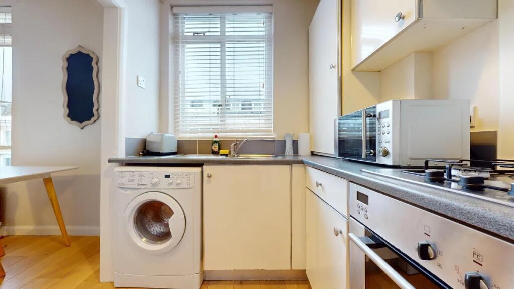 Bright and well-maintained kitchen featuring mo...