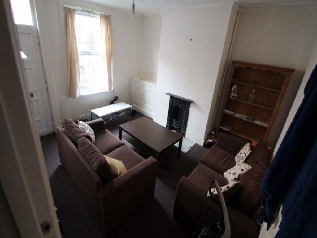 A cozy living room featuring a comfortable sofa...
